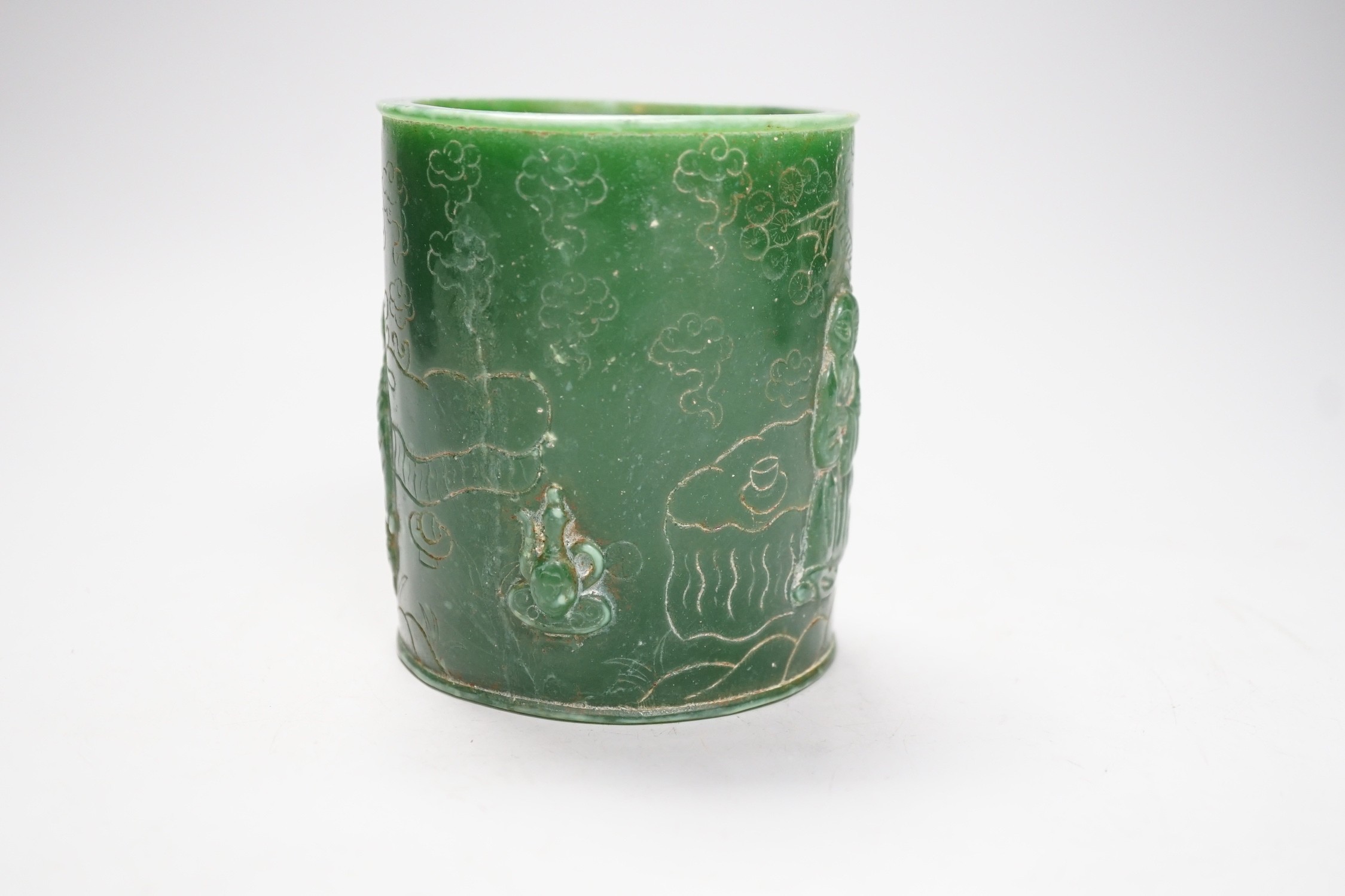 A Chinese incised green glass cylindrical brushpot, 11cm